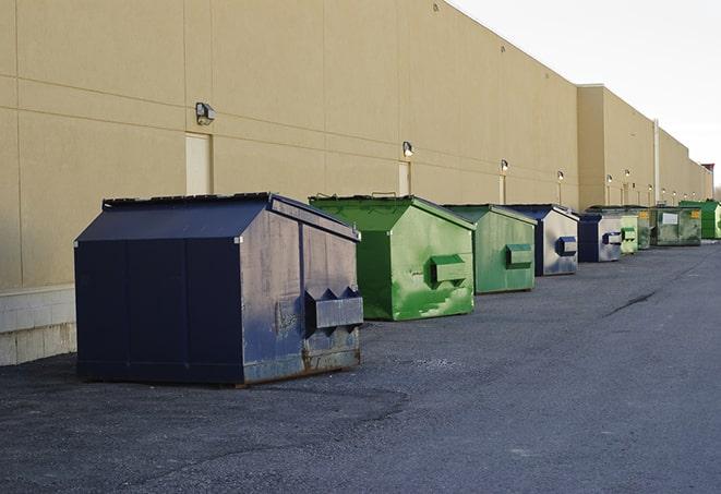 construction dumpsters on a worksite surrounded by caution tape in Albany IL